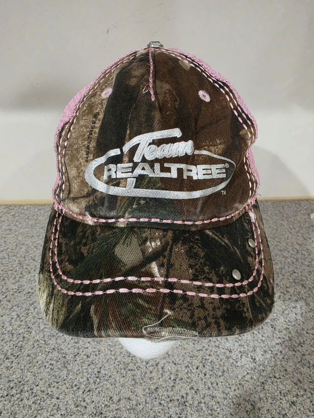 Realtree Camo Hat with Pink Stitching and White Logo